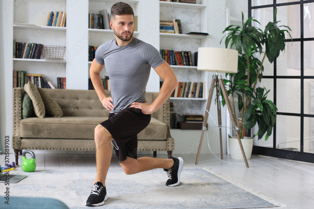 Handsome man doing sport exercise at home. Concept of healthy life. Handsome man doing sport exercise at home. Concept of healthy life.