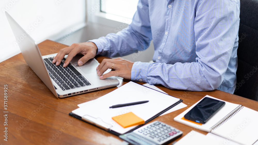 © snowing12 - hands close up Freelancer busy working on a laptop computer on desktop.