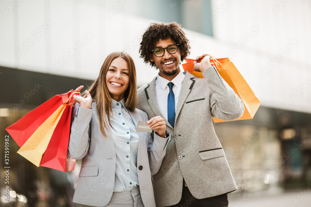 Couple in shopping. Happy couple with shopping bags and credit card enjoying in shopping. Couple in shopping. Happy couple with shopping bags and credit card enjoying in shopping.