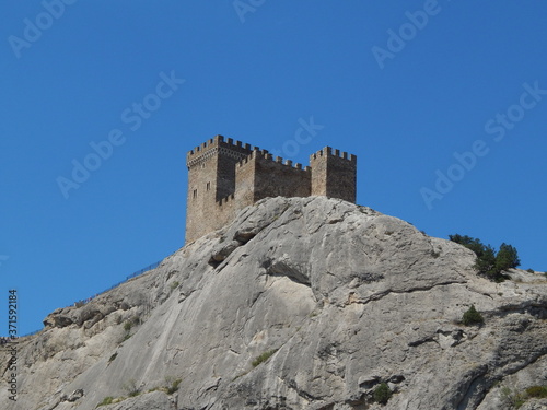 genoese fortress, castle on a rock, sunny