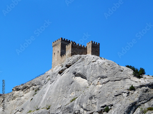 genoese fortress, castle on a rock, sunny