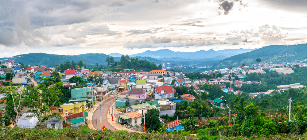 Small village in a tea hill valley on afternoon in the highlands of Da Lat, Vietnam. The place provides a great deal of tea for the whole country