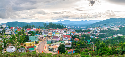 Fototapeta Naklejka Na Ścianę i Meble -  Small village in a tea hill valley on afternoon in the highlands of Da Lat, Vietnam. The place provides a great deal of tea for the whole country