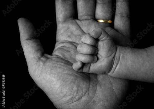 married man and baby hand