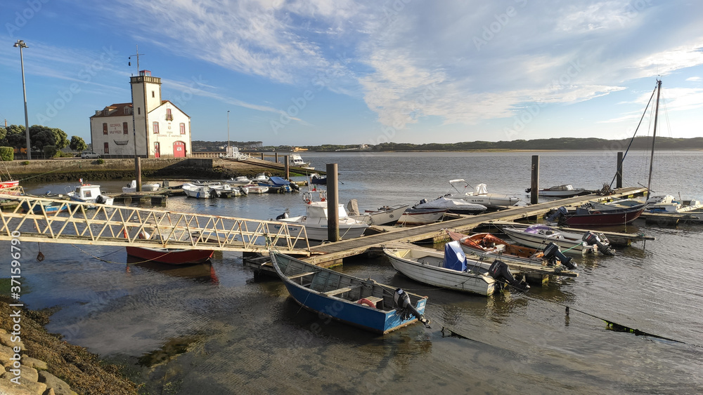 Fototapeta premium Esposende / Portugal - July 31, 2020: The Marina of Esposende, located on the river, it is situated at the estuary of the river Cávado. The Maritime Museum in the background.