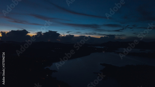 Aerial view of Kenyir Lake during blue hour sunrise.