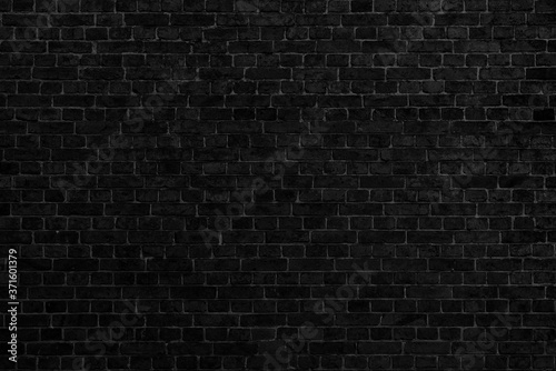 Black brick building wall. Interior of a modern loft. Background for design and interview recording.