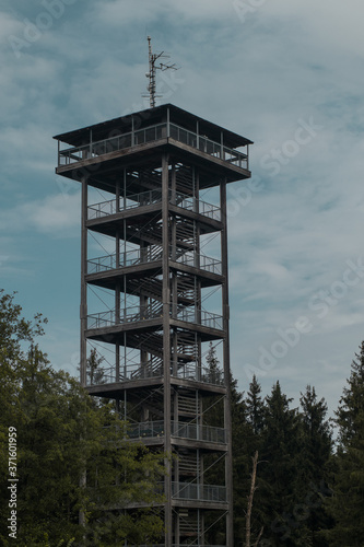Aussichtsturm Lichtenberg, a man made lookout tower of metal and wood in the Attergau region of Austria, rising high above the local hills in cloudy weather. photo