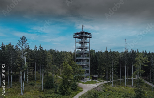 Aussichtsturm Lichtenberg, a man made lookout tower of metal and wood in the Attergau region of Austria, rising high above the local hills in cloudy weather. photo