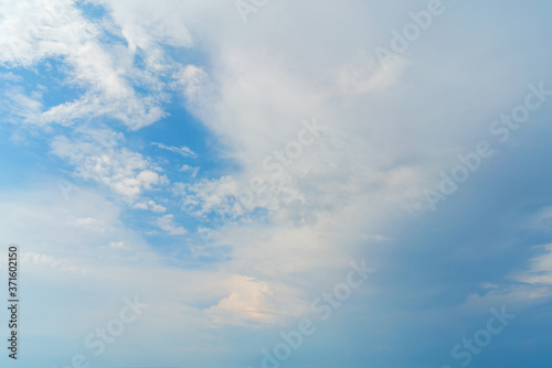 White clouds in the blue sky. Atmospheric natural background.