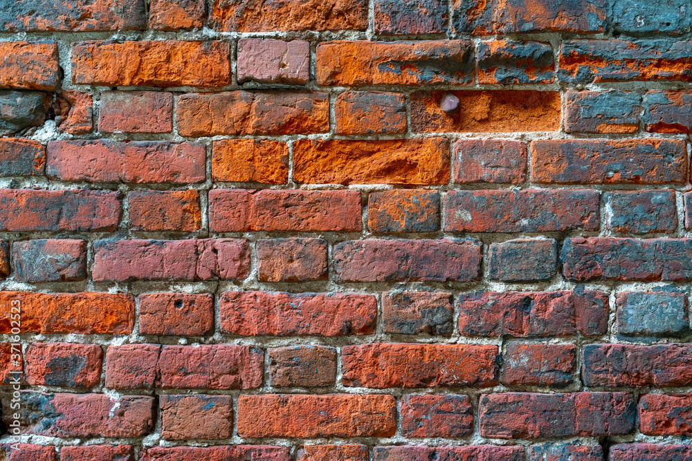 Fototapeta premium Red brick building wall. Interior of a modern loft. Background for design and interview recording.