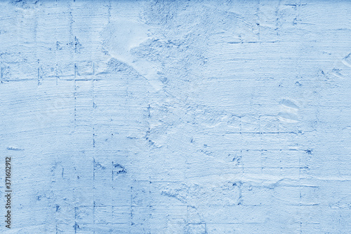 Blue wall of the building. Rough plaster surface. Abstract background. © sandipruel