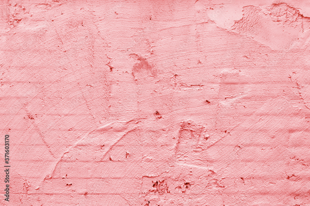 Pink wall of the building. Rough plaster surface. Abstract background. Pink wall of the building. Rough plaster surface. Abstract background.