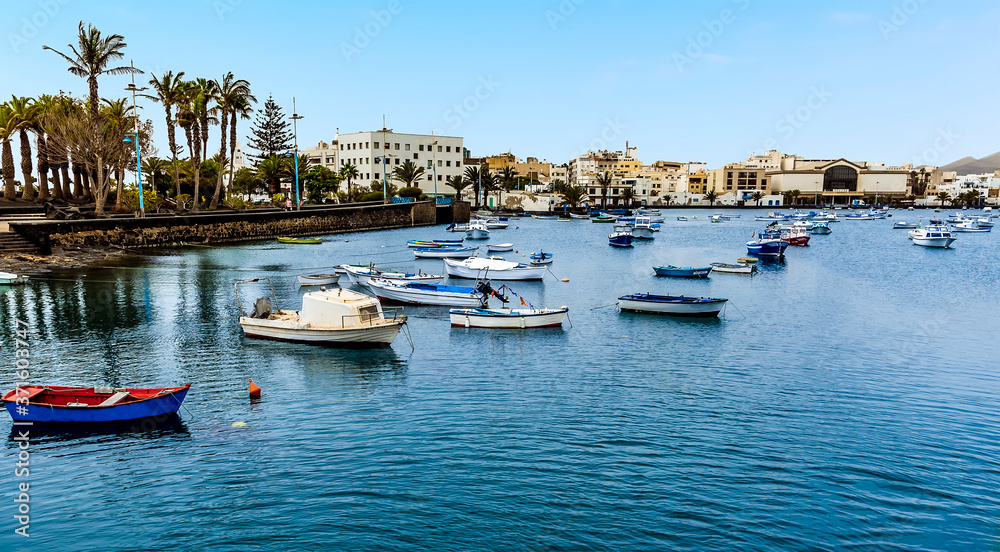 Small boats moored in the lagoon of Charco de San Gines in Arrecife, Lanzarote on a sunny afternoon