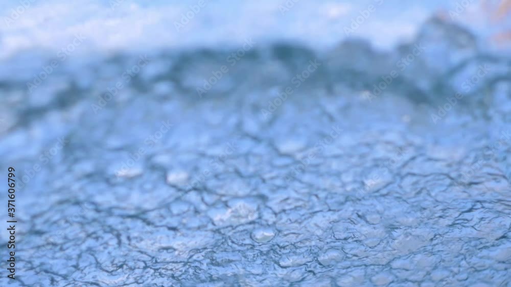 Waters flow down the glass window. Abstract waves. Stormy rain weather. Aqua tranquil color. Waters flow down the glass window. Abstract waves. Stormy rain weather. Aqua tranquil color.