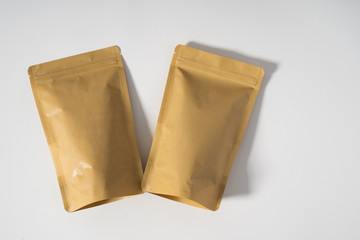 blank standing pouch mockup brown laying on white