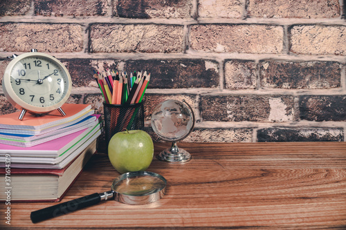 back to school concept. stationery items on wooden desk