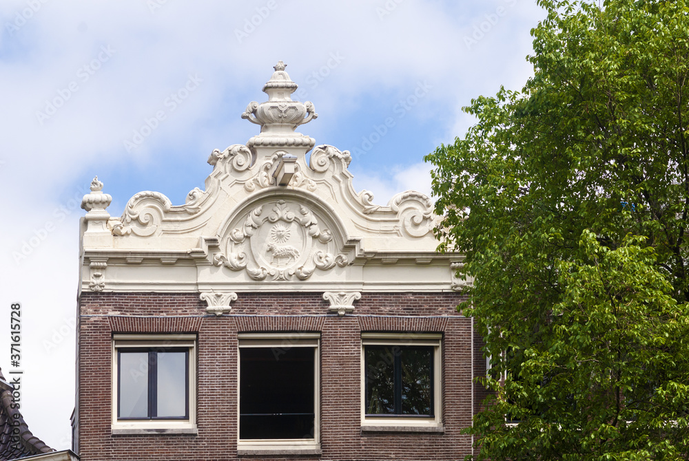 coat of arms on a brick facade in Amsterdam, Netherlands