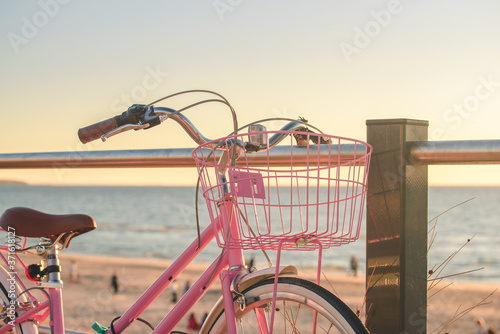 Photography Pink vintage bicycle parked next to the beach in South Australia