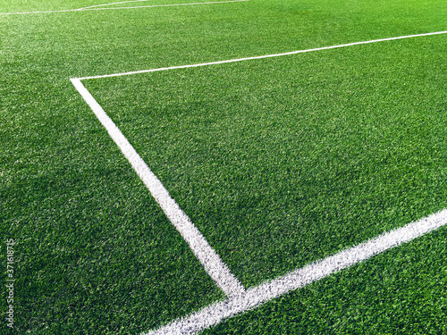 Stadium. Green grass soccer field with white markings. photo