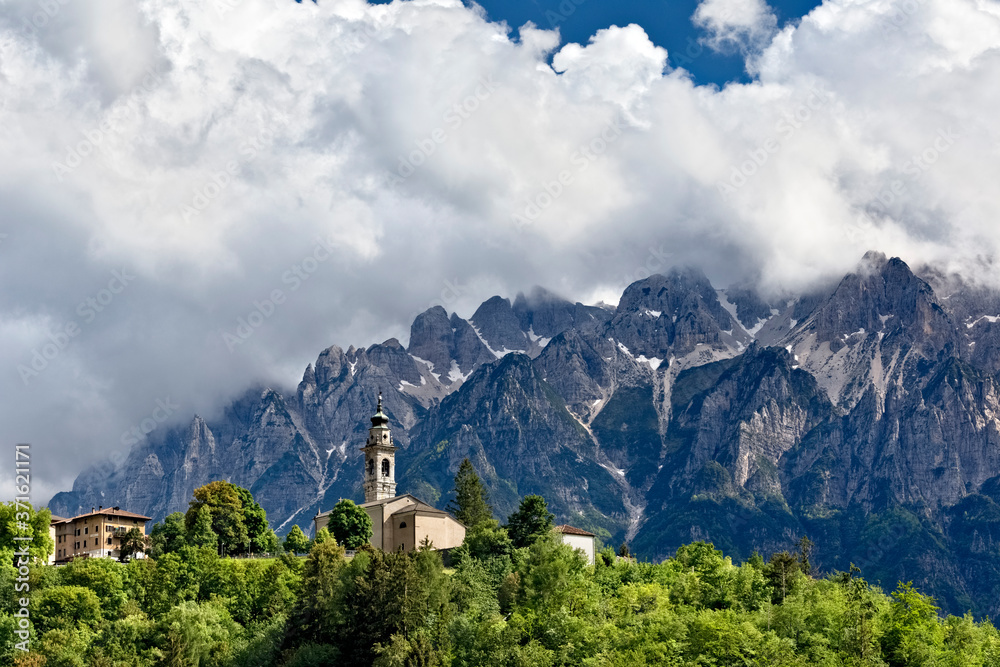 The village of Parrocchia and in the background Mount Carega of the Piccole Dolomiti. Vallarsa, Trento province, Trentino Alto-Adige, Italy, Europe.