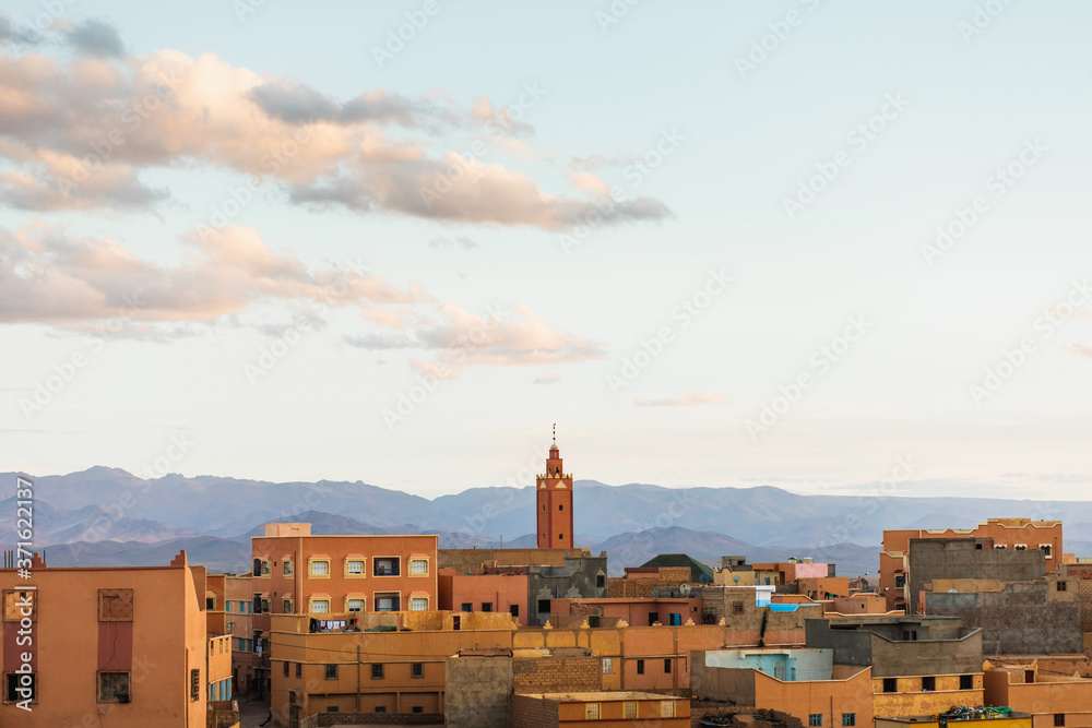Aerial view of old moroccan town Boumalne at sunset. Traditional style and color of arabian architecture in Morocco.
