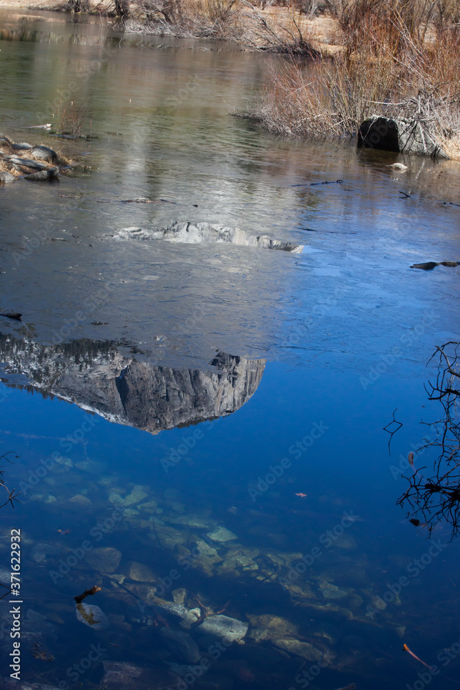 Mountains reflected in a river Mountains reflected in a river