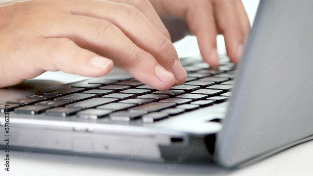 Closeup of a female hands busy typing on a laptop to working. Closeup of a female hands busy typing on a laptop to working.