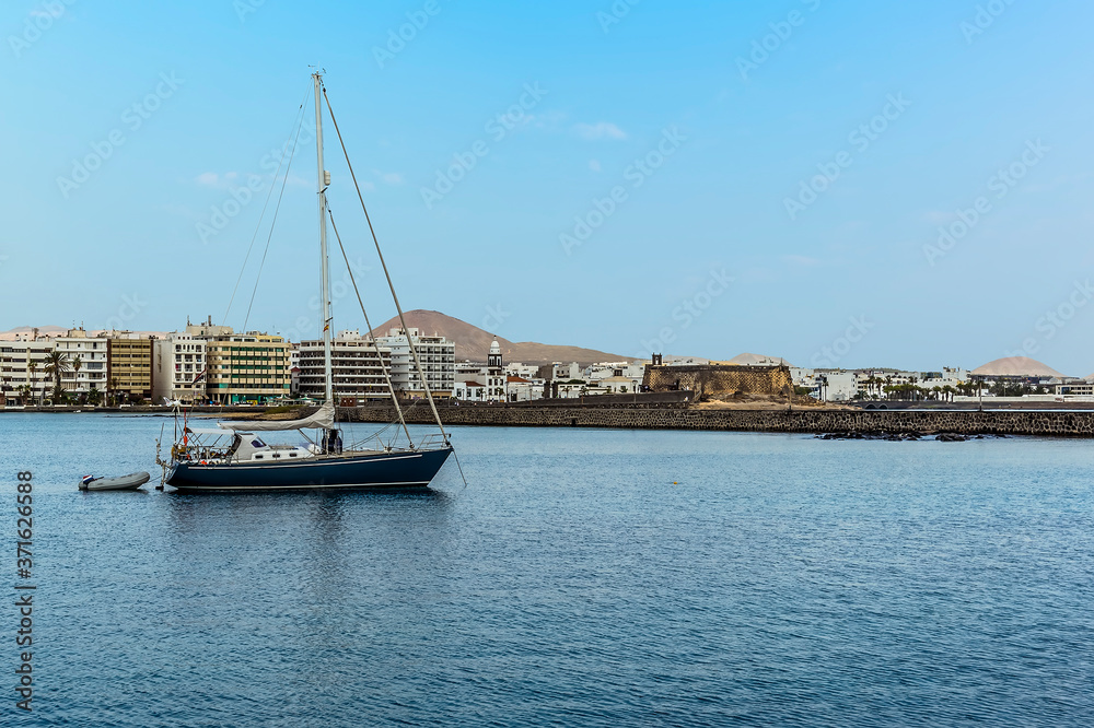 A view across the bay in Arrecife, Lanzarote towards the causeway and the shoreline on a sunny afternoon
