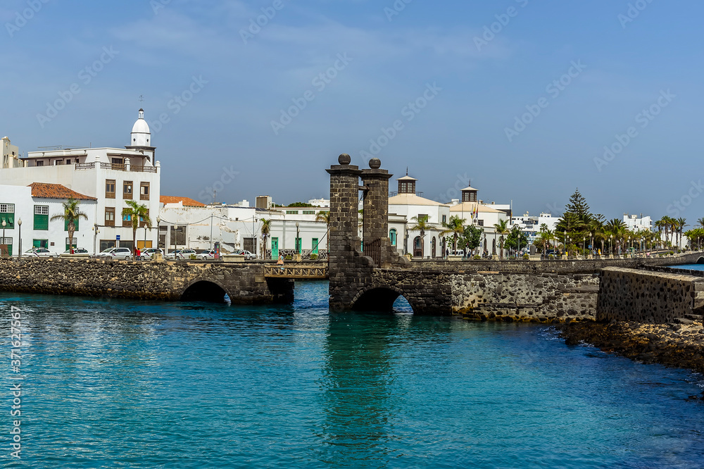 A view of the causeway and the shoreline in Arrecife, Lanzarote on a sunny afternoon