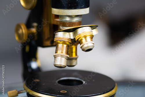 Vintage microscope with brass details.