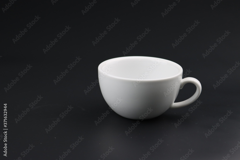Empty white coffee cup on black color background Empty white coffee cup on black color background