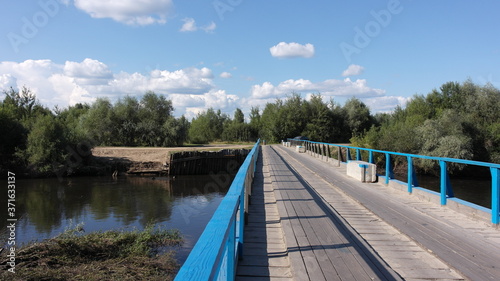 wooden bridge across the river