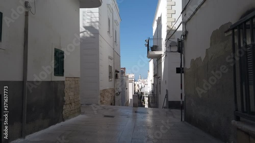 walking through south italy village narrow streets of Vieste in Puglia - Italy 