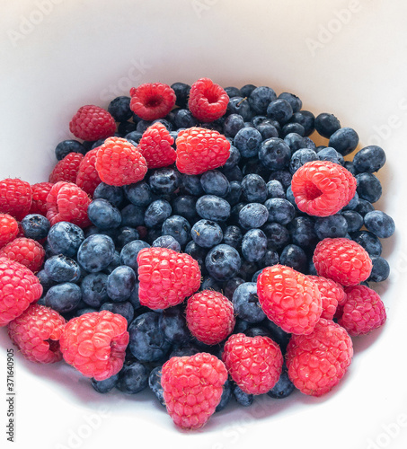Colorful, juicy background of blackberries and raspberries. Healthy food concept.