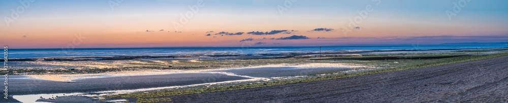 Luc Sur Mer, France - 08 04 2020: Panoramic view of the sea from the beach at sunset