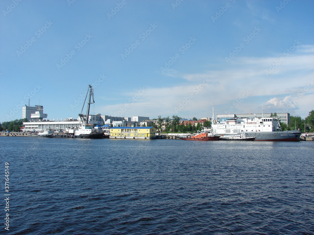 View of the city and moored ships from the river