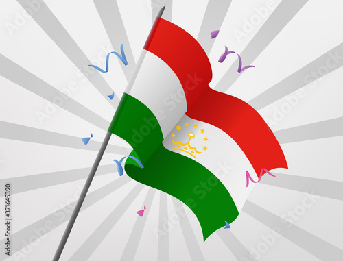 The celebration flag of the country of Tajikistan flies at a height