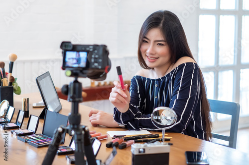 Young asian women live live selling cosmetics online.