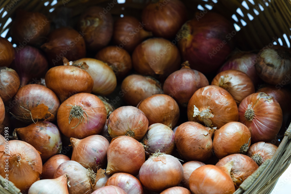 Close up view of small Onions. Indian vegetables heap small shallot onions from market Close up view of small Onions. Indian vegetables heap small shallot onions from market