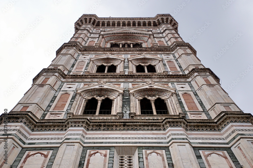 Detail of the famous giotto's campanile, bell tower of the basilica of Santa Maria del Fiore (Saint Mary of the Flower), cathedral of Florence, Italy.