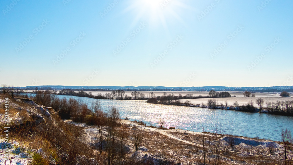 Winter landscape with river in sunny weather Winter landscape with river in sunny weather