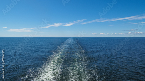 Panoramic view of boat wake on the open sea