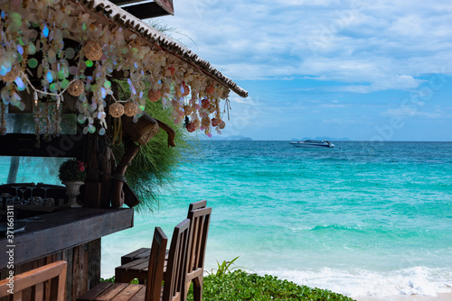 Fototapeta Naklejka Na Ścianę i Meble -  authentic beach bar with a large selection of alcohol on a tropical island in andaman sea. Mai Thon island. Thailand
