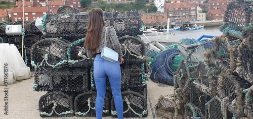 young girl looking in crab cages