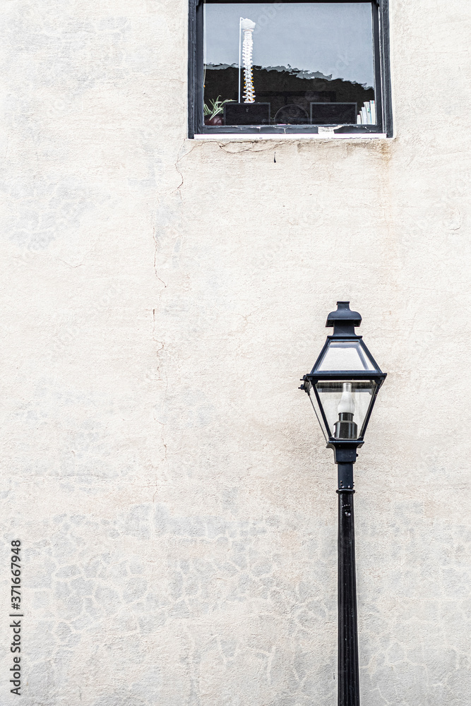 street lamp in front of wall