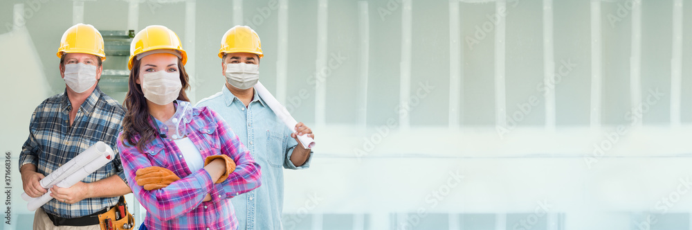Female and Male Contractors In Hard Hats Wearing Medical Face Masks At Construction Site During Coronavirus Pandemic Banner Female and Male Contractors In Hard Hats Wearing Medical Face Masks At Construction Site During Coronavirus Pandemic Banner