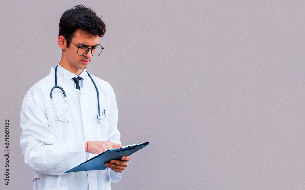 Cheerful doctor posing and smiling at camera, healthcare and medicine Cheerful doctor posing and smiling at camera, healthcare and medicine