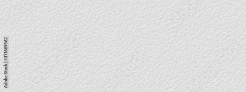 Abstract white stone wall, background - in the form of a rough embossed stone surface, closeup
