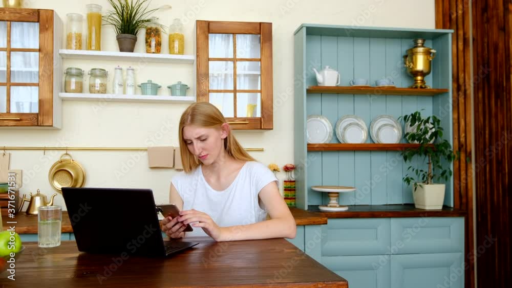Serious young woman working at home Serious young woman working at home